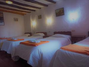 Voodi või voodid majutusasutuse Hostal Tu Hogar toas