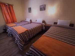 Voodi või voodid majutusasutuse Hostal Tu Hogar toas