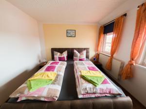 Postel nebo postele na pokoji v ubytování Pension Dalina