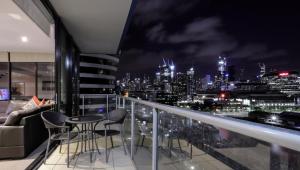 a view from a balcony overlooking a city at AKOM AT Docklands in Melbourne