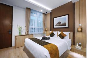 Letto o letti in una camera di S7 SUITES GANDARIA