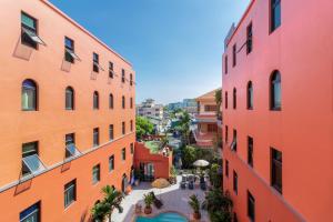 an aerial view of an alley between two buildings at Baansuanprannok Hotel in Bangkok