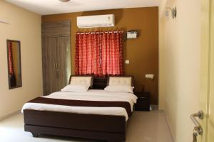 Una cama o camas en una habitación de Phoenix Serviced Apartment - Sai Illam