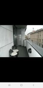 a room with two tables and chairs on a building at La dolce vita (1) in Bergamo