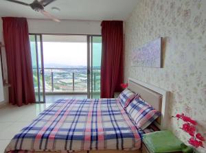a bedroom with a bed and a large window at Comfort Zone Premium Guesthouse @ Evo Bangi in Bangi