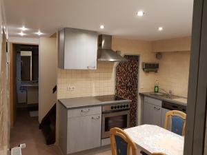 a kitchen with a sink and a stove top oven at Ferienwohnung 2 in Nähe der Ostsee in Grevesmühlen