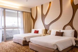 Postel nebo postele na pokoji v ubytování The 5 Elements Hotel Chinatown Kuala Lumpur