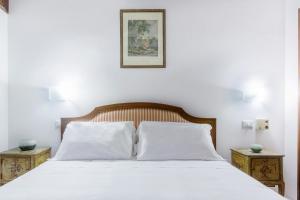Ένα ή περισσότερα κρεβάτια σε δωμάτιο στο Center ZTL Lovely Apartment