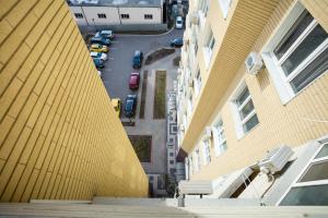 an aerial view of a street between two buildings at Apartment near Obolon metro station in Kyiv