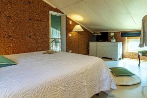 A bed or beds in a room at Lotus House