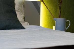 A bed or beds in a room at Lotus House