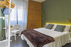 A bed or beds in a room at Lotus House