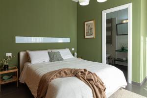 A bed or beds in a room at Lotus House