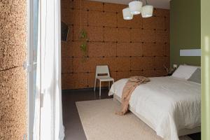 A bed or beds in a room at Lotus House