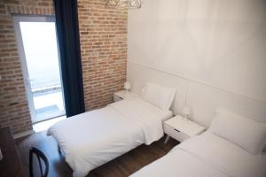 Letto o letti in una camera di Old Bazaar Rooms