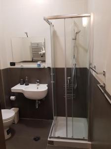 a bathroom with a shower and a sink at GISELLE in Naples +34 photos