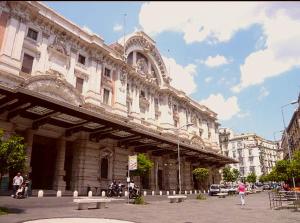 a large stone building with benches in front of it at GISELLE in Naples