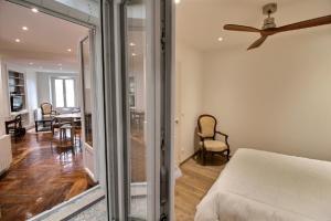 a bedroom with a bed and a living room at 104525 - Appartement 4 personnes à Paris in Paris
