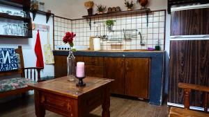 a kitchen with a table with a candle on it at Casa Armando in Icod de los Vinos