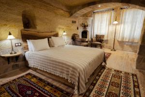 Ένα ή περισσότερα κρεβάτια σε δωμάτιο στο Sultan Cave Suites