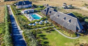 an aerial view of a house with a swimming pool at The Last Village Lodge in Athi River
