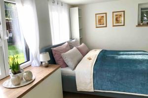 a bedroom with a bed and a window at Wohlfühloase in Pankow in Berlin