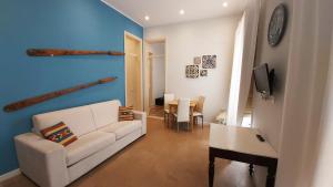 A television and/or entertainment centre at Boutique Rooms and Breakfast GranVeliero