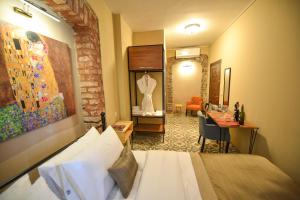A bed or beds in a room at Maravilloso Hotel Pera