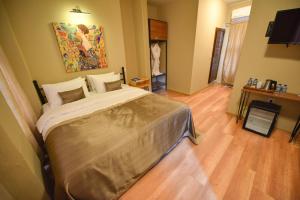 A bed or beds in a room at Maravilloso Hotel Pera