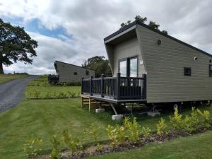 a tiny house on the side of a road at Marbury Camp and Lodge in Whitchurch