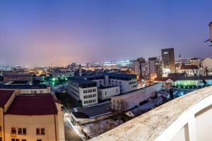 a view of a city at night with buildings at Briana Luxury Sky View Studio in Cluj-Napoca