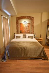 A bed or beds in a room at Maravilloso Hotel Pera