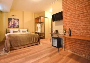A bed or beds in a room at Maravilloso Hotel Pera