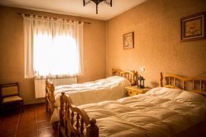 Ένα ή περισσότερα κρεβάτια σε δωμάτιο στο Casa La Escondida