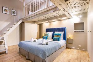 Cama ou camas em um quarto em Dreamyflat - Marais II