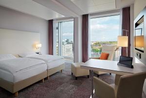Postelja oz. postelje v sobi nastanitve Radisson Blu Hotel Leipzig