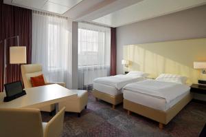 Postelja oz. postelje v sobi nastanitve Radisson Blu Hotel Leipzig