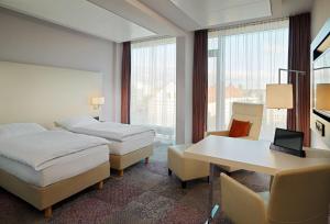 Postelja oz. postelje v sobi nastanitve Radisson Blu Hotel Leipzig
