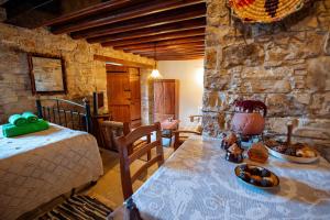 a room with a table with food on it at Constantias stone houses in Lofou