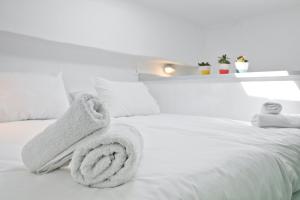 A bed or beds in a room at Scaleri Port Home