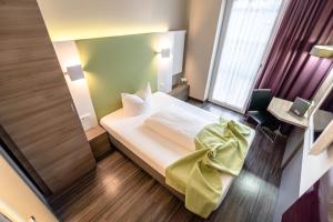 Een bed of bedden in een kamer bij Hotel Demas City