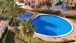 Basen w obiekcie Apartamento ÁTICO SOL Los Miradores del Puerto lub w pobliżu
