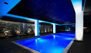 a swimming pool in a building with a starry sky at Gudauri Lodge in Gudauri