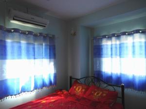 Krasom Homestay客房内的一张或多张床位