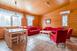 Posezení v ubytování Lomaperkkiö Apartments + 26 fotografií