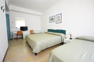 Postel nebo postele na pokoji v ubytování Grand Hotel Delle Terme