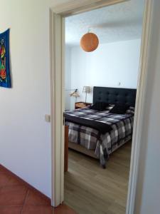 Ένα ή περισσότερα κρεβάτια σε δωμάτιο στο Casa Gomikika