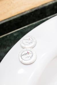 a close up of two plates on a white car at Gran Hotel Victoria in El Ejido