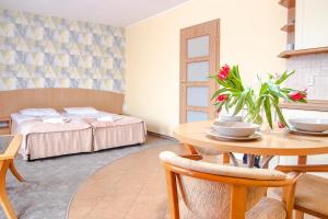Postel nebo postele na pokoji v ubytování AL-DOM apartamenty Olymp Sunshine