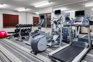 a fitness room with treadmills and cardio equipment at Candlewood Suites Warner Robins by IHG in Warner Robins +7 photos